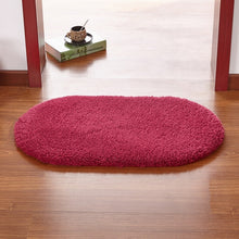 Modern oval rug with soft and plush microfiber texture and anti-slip back