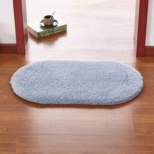 Modern oval rug with soft and plush microfiber texture and anti-slip back