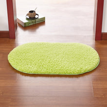 Modern oval rug with soft and plush microfiber texture and anti-slip back