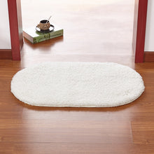 Modern oval rug with soft and plush microfiber texture and anti-slip back