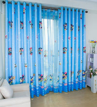 Blue Mickey Mouse Curtain Shown Over a room window and Tulle backing.